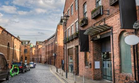 Exterior of 43 the Calls, cobbled Street  Lined with Renovated Brick Buildings