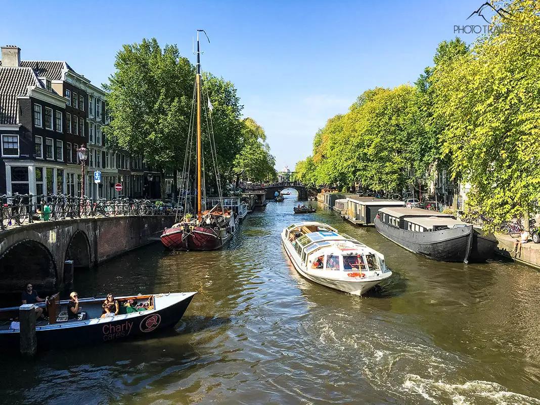 The view over a canal with an excursion boat
