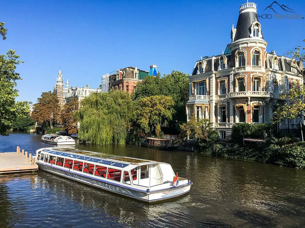 A tour boat on a canal in Amsterdam