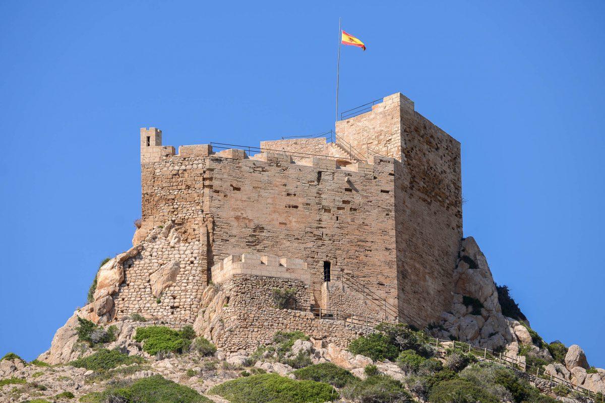 The medieval castle of Cabrera dates from the 14th century and towers unmistakably over Cala Donzell, Mallorca, Spain - © James Camel / franks-travelbox